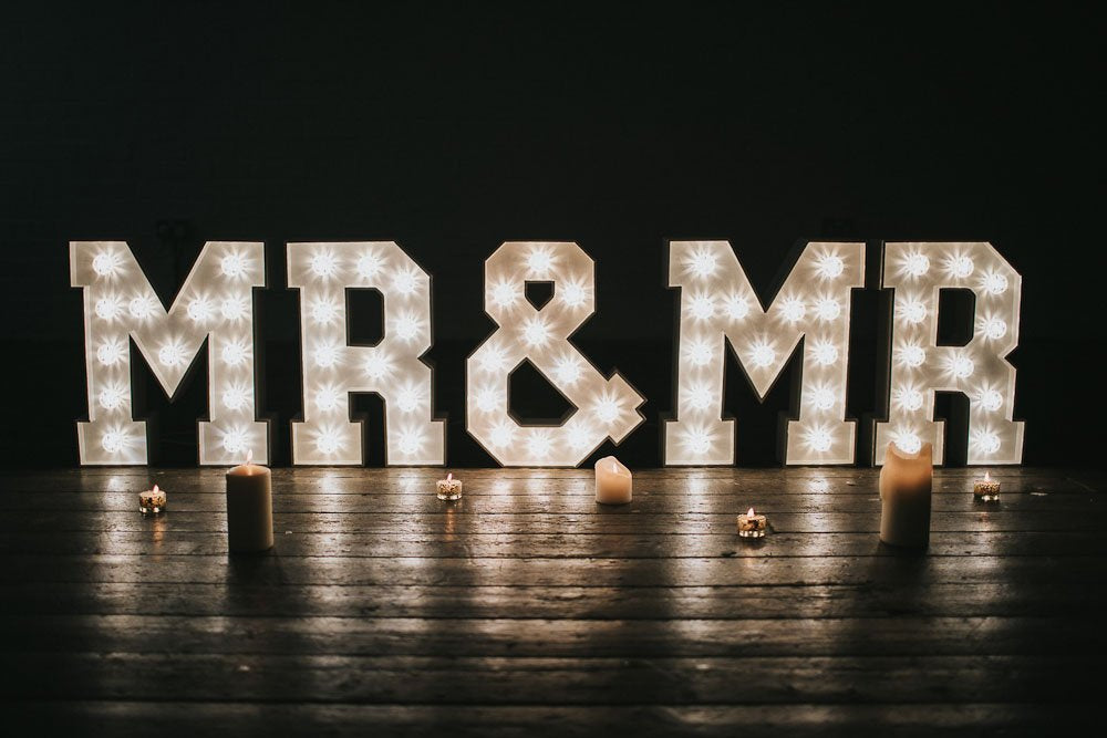MR & MR light up letters glowing with warm white LED bulbs – a stylish feature for modern wedding venues.