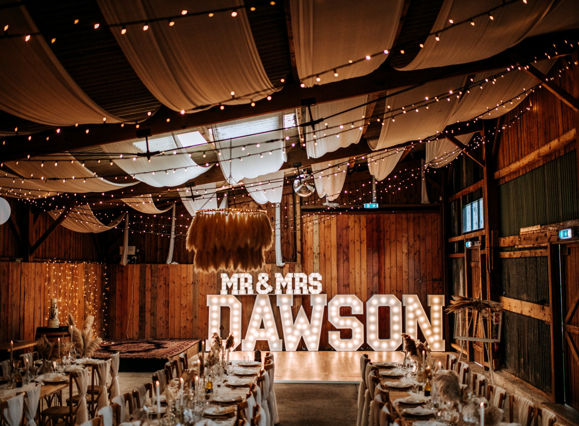 5ft Mr&Mrs Dawson Wedding light up letters in a rustic barn venue