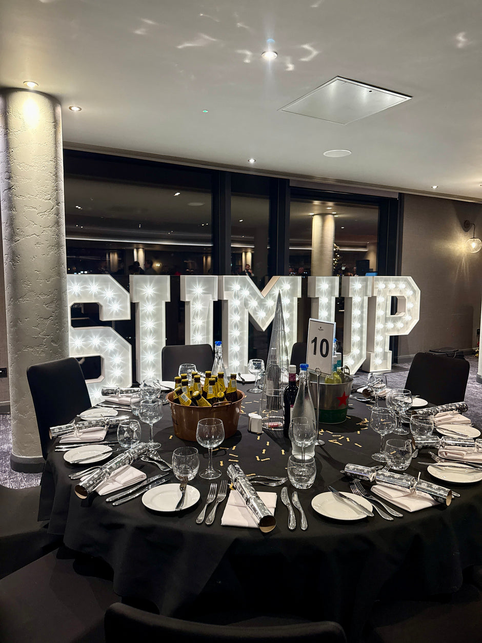 SUMUP branded light up letters at a corporate product launch event