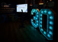 Load image into Gallery viewer, Illuminated number 30 for corporate anniversary event, blue LED letter hire UK
