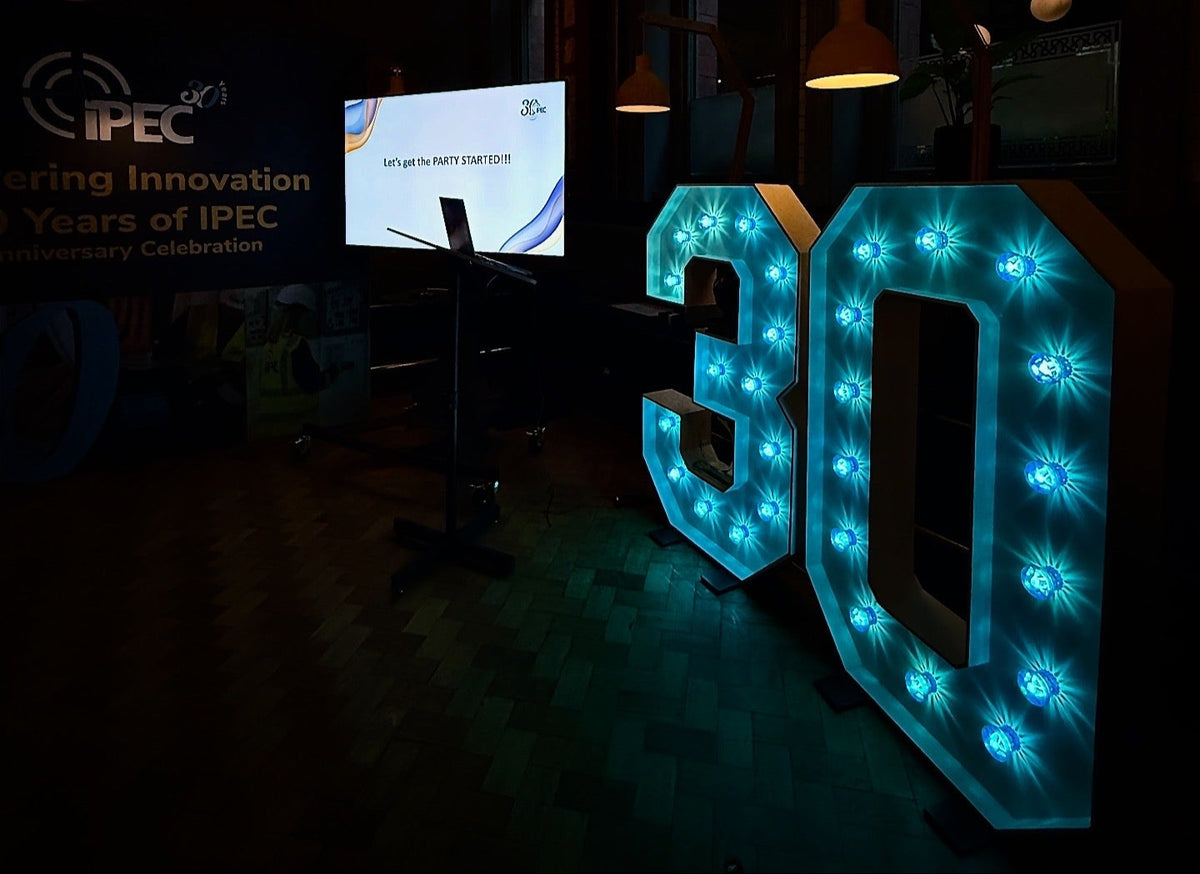 Illuminated number 30 for corporate anniversary event, blue LED letter hire UK