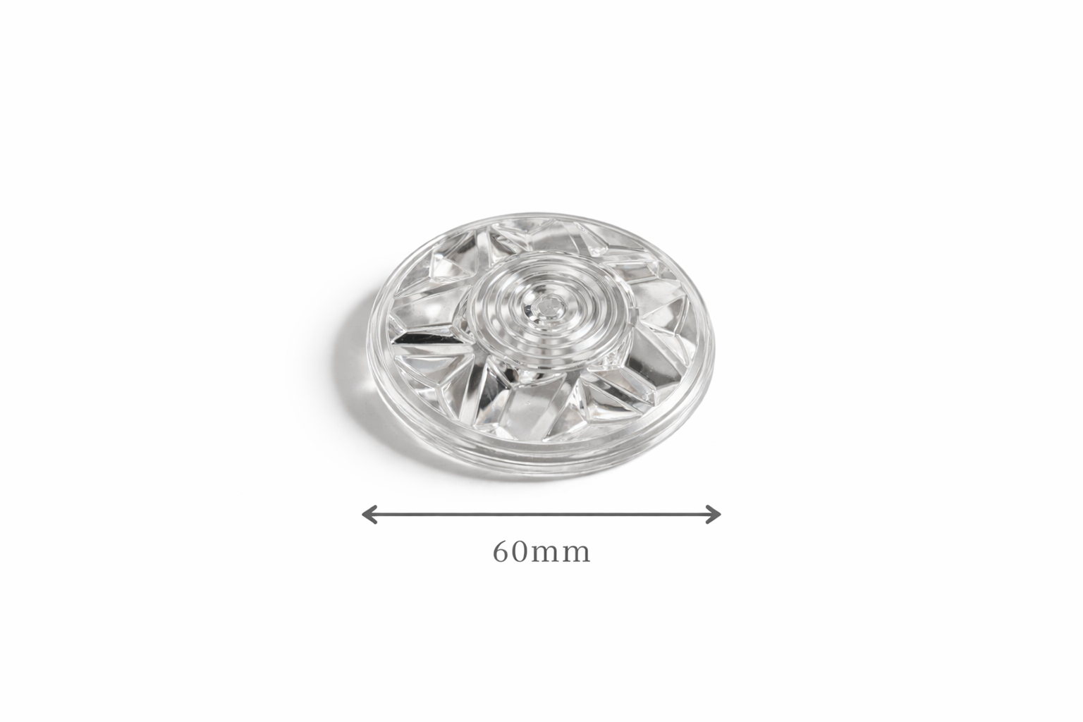 Clear plastic light cap component with measurement label on a white background