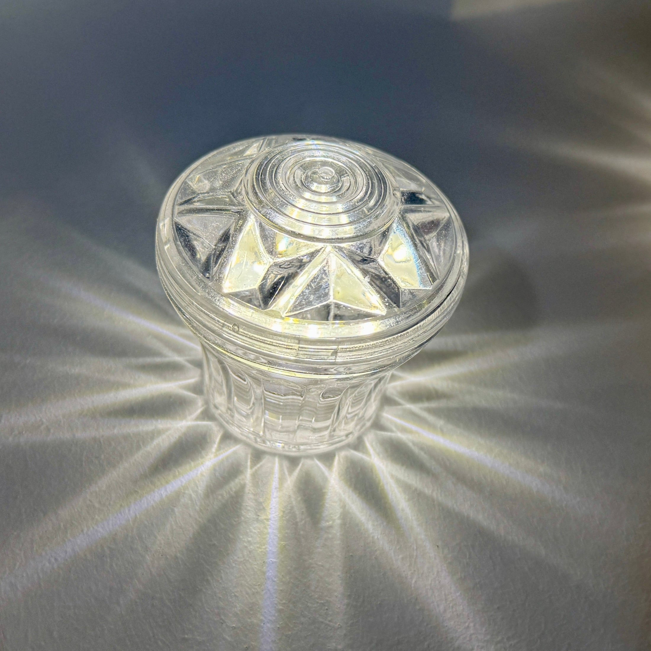 E14 screw fitting detail on clear cabochon light base for fairground and event lighting