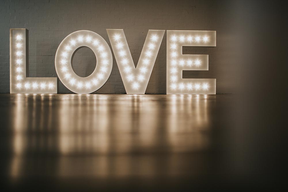 Large 5ft light up letters displayed at a wedding venue, illuminated with warm white LED bulbs – perfect for creating standout photo moments.