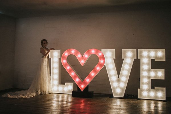Large 5ft light up letters displayed at a wedding venue, illuminated with warm white LED bulbs – perfect for creating standout photo moments.