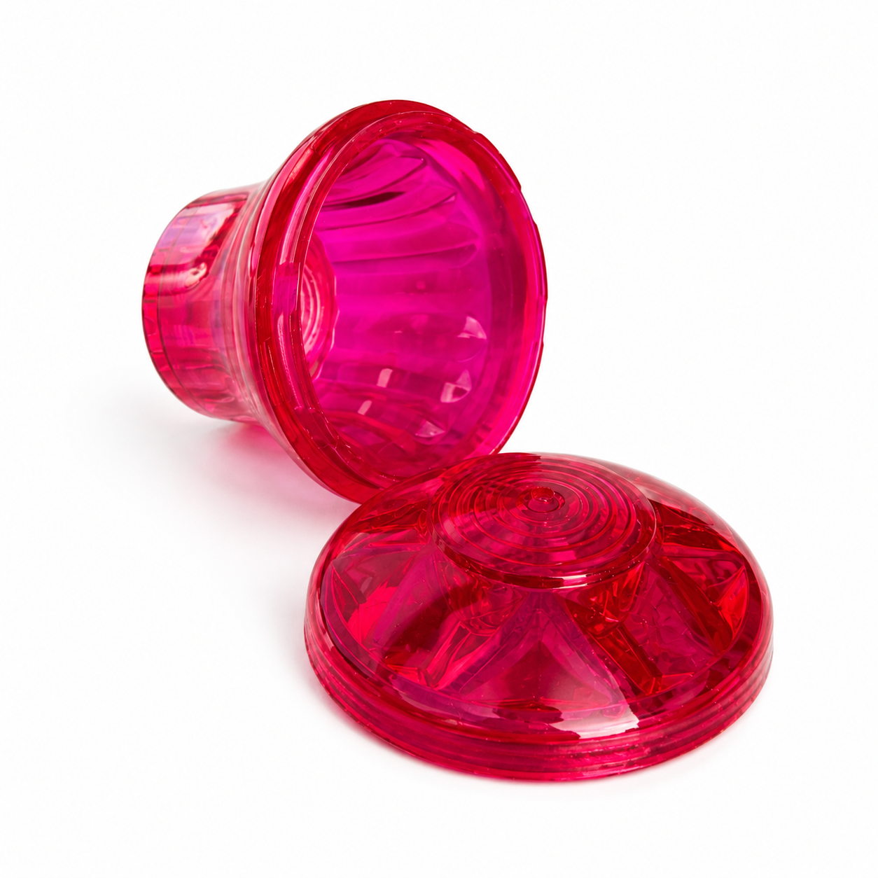 Two pink transparent plastic cups on a white background